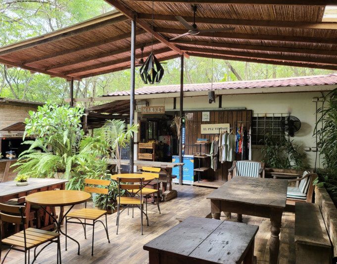Machete Market Café Charming outdoor seating and vibrant food offerings at Machete Market Café in San Juan del Sur, known for its fresh, locally sourced meals and coffee