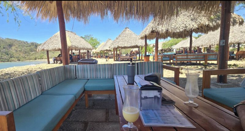 Aquaholic Beach Bar's open-air seating with ocean views and tropical ambiance in San Juan del Sur, Nicaragua