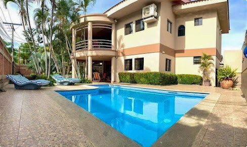 Cooper Villa's private pool area with garden view in San Juan del Sur, Nicaragua