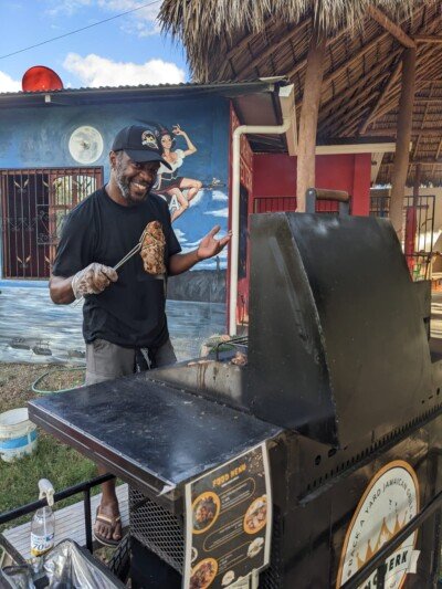 King Jerk Grill's signature jerk chicken platter served with traditional sides in San Juan del Sur, Nicaragua