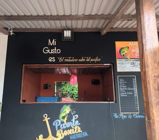 Outdoor dining area at Marisquería Puerto Bonito with ocean views in San Juan del Sur, Nicaragua