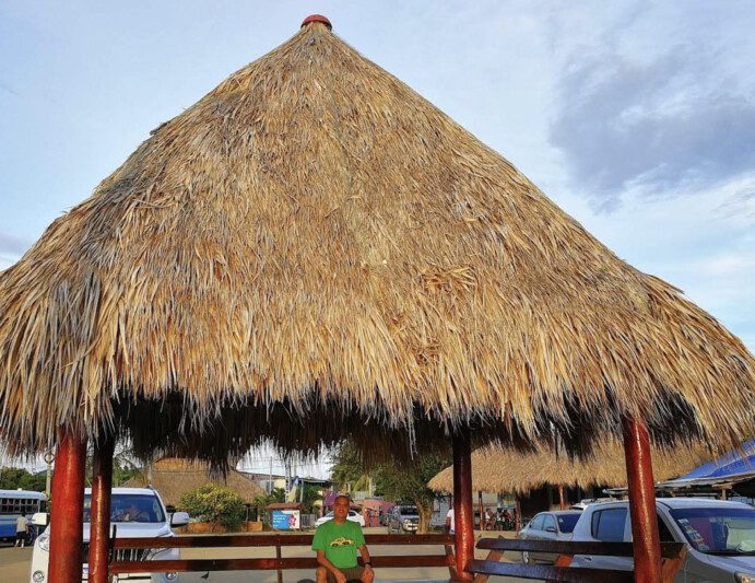 Outdoor dining area at Ranchos de San Juan del Sur featuring rustic decor and views of the surrounding landscape​