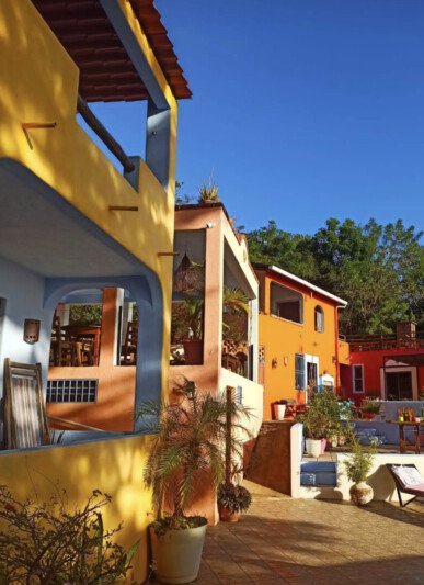El Jardín Hotel y Restaurante in San Juan del Sur, featuring an outdoor pool with panoramic ocean views and lush tropical gardens.​