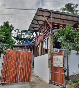 Exterior view of Nuestra Casa Boutique Bed and Breakfast with pool and terrace in San Juan del Sur, Nicaragua