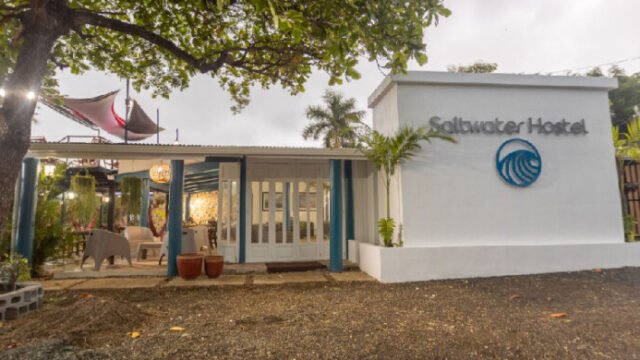 Exterior view of Saltwater Hostel with garden lounge in San Juan del Sur, Nicaragua