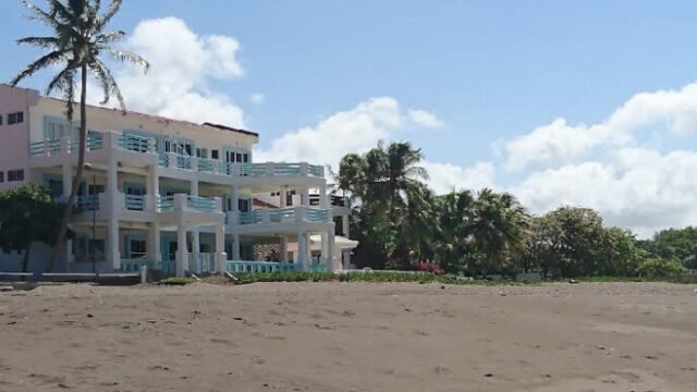 Exterior view of Hola Ola Hostel with pool and communal area in San Juan del Sur, Nicaragua