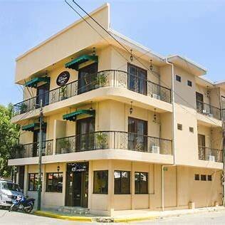 Hotel La Estación façade with balconies and colonial charm, located near the beach in San Juan del Sur
