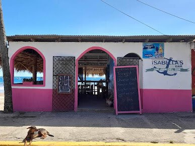 Outdoor seating area of Isabella's Bar with ocean view in San Juan del Sur, Nicaragua