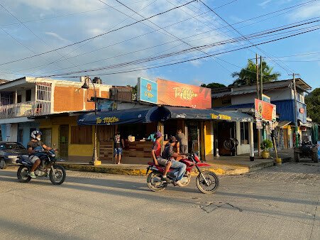 Interior of Tío Milton Bar showcasing vibrant decor and lively atmosphere in San Juan del Sur, Nicaragua