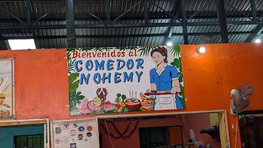 Interior of Comedor Nohemy with traditional Nicaraguan dishes served in San Juan del Sur's municipal market
