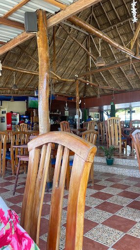 Beachfront classroom at Lago Azul Spanish School with students and teacher overlooking the bay in San Juan del Sur