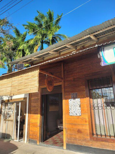A skilled artist creating a custom design inside Ink Tattoo in San Juan Del Sur