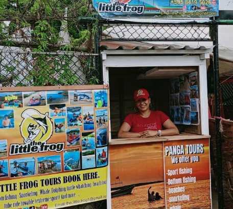 Little Frog Tours image of stall with worker in red