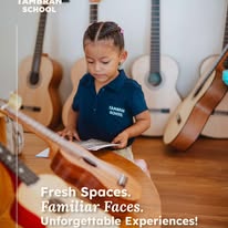 Gio music teacher giving guitar & ukulele lesson at Tambran Campus SJDS