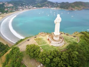 San Juan Del Sur Bay, Nicaragua, aerial image of the famous Jesus statue looking down over the bay: Is Nicaragua Safe 2026 Essential Guide